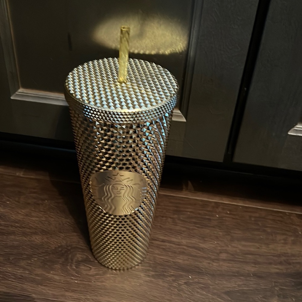 Gold Starbucks holiday cup